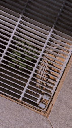 Photo of steal grate in concrete