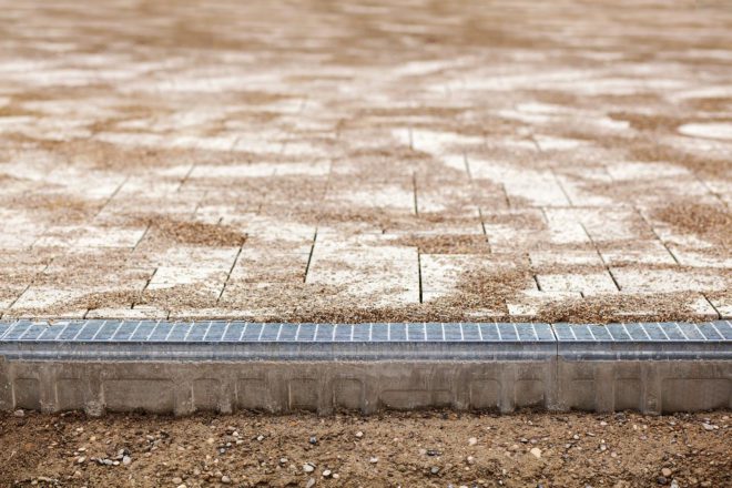 Photo of stainless steel drain on footpath